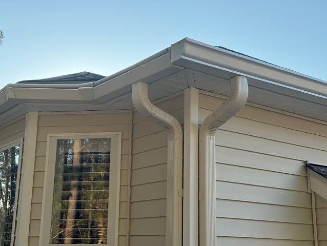 Seamless aluminum gutters and downspouts