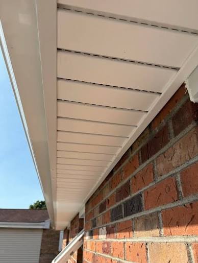Hidden-vent soffit under the eave